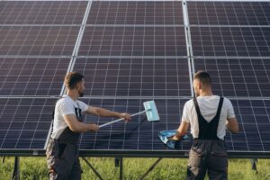Labor working on cleaning solar panel at solar power plant, Professional cleaning, Solar panels.